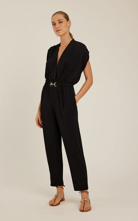 Combinaison noire Lenny Niemeyer en maille avec encolure transversale, ceinture élastique à boucle dorée et jambes fuselées