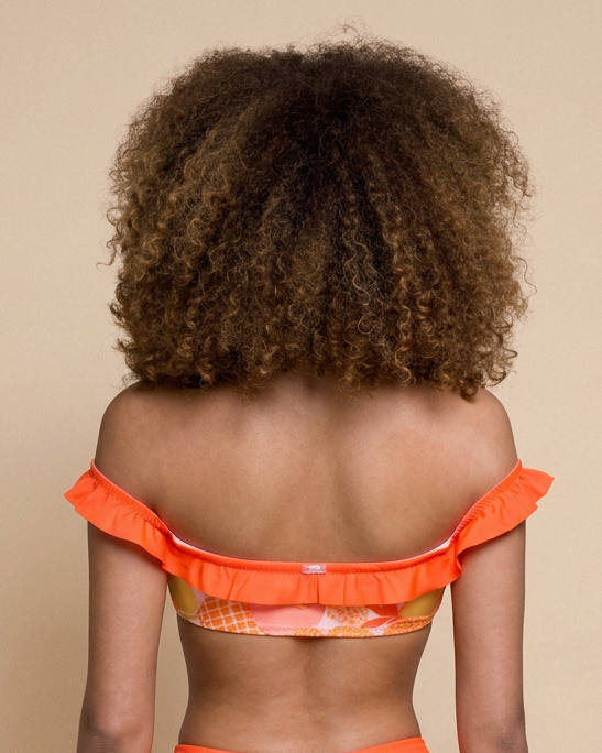 Shandra Tuttifrutti WI-PARIS bandeau à volants avec nœud central effet push-up et imprimé tropical coloré.