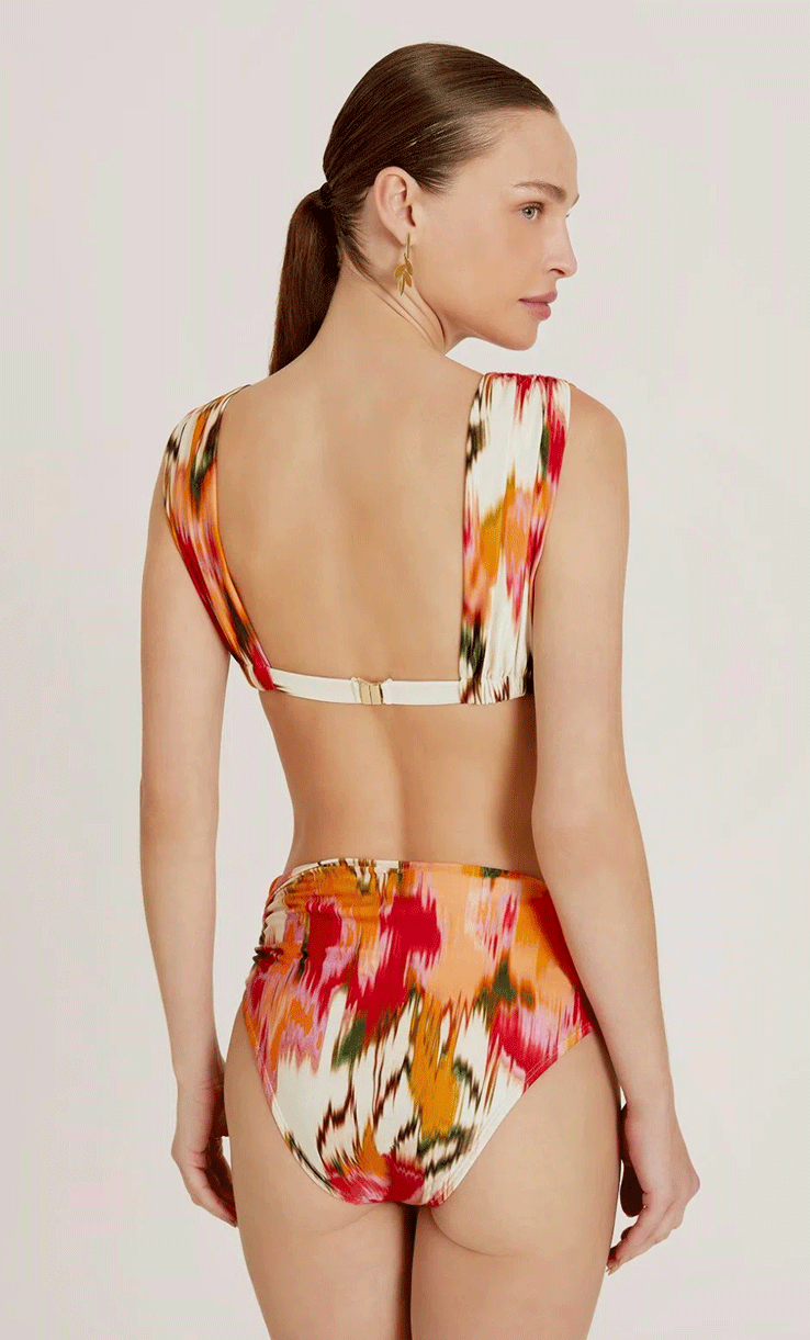 Bas de bikini taille haute Aral Lenny Niemeyer avec imprimé multicolore et volants latéraux, coupe modulable confortable.