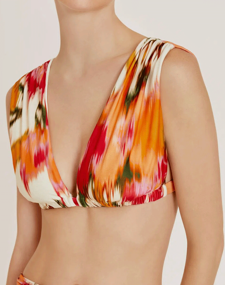 Haut de bikini Aral Lenny Niemeyer avec imprimé rose et jaune, soutien-gorge plissé, bretelles drapées et fermeture dorée.